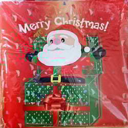 A Merry Christmas card with Santa coming out of a gift box.