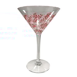 A martini glass with red berries on it.
(There are no grammatical errors in the original sentence.)
