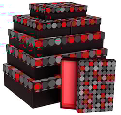 A stack of black boxes with red and gray polka dots on them.
