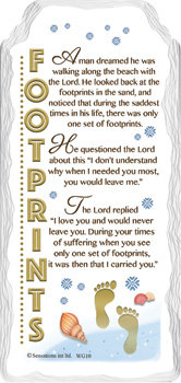 A sign that says "Footprints in the Sand" on it.