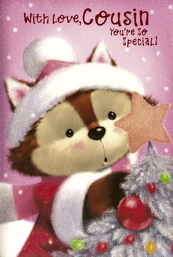 A teddy bear wearing a Santa hat is holding a star and a Christmas tree.