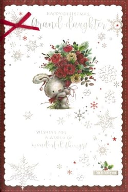 A Christmas card with a bunny holding a bouquet of flowers.