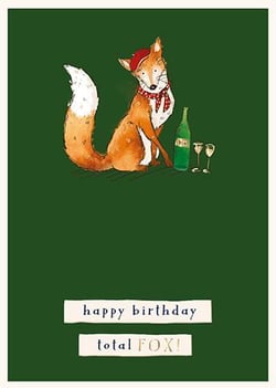 A fox wearing a Santa hat and scarf is holding a bottle of champagne and two glasses of wine.