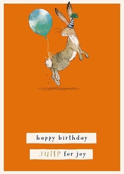 A birthday card with a rabbit jumping in the air, holding a balloon.