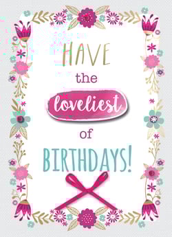 A birthday card that says, "Have the loveliest of birthdays."