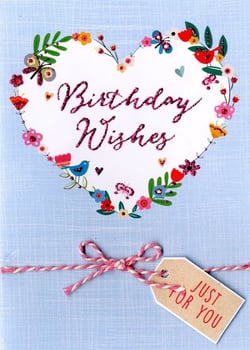 A birthday card with a heart surrounded by flowers and a tag that says "just for you."