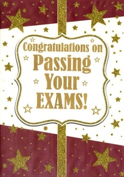 A card that says "Congratulations on passing your exams."