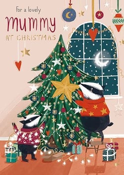 A Christmas card with two badgers decorating a Christmas tree.