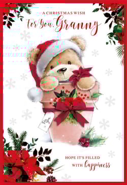 A Christmas card with a teddy bear wearing a Santa hat.