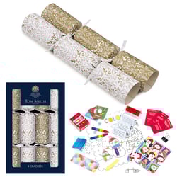 a box of tom smith crackers sits next to a christmas cracker