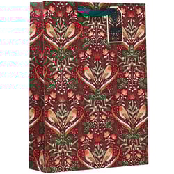 a gift bag with birds and flowers on it