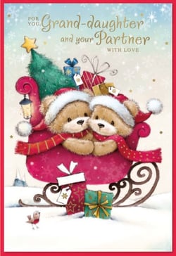 two teddy bears are sitting in a sleigh with gifts and a christmas tree .