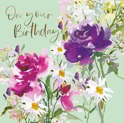 A birthday card with flowers and the words "on your birthday."