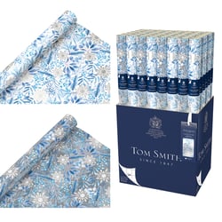 a box of tom smith wrapping paper with snowflakes on it
