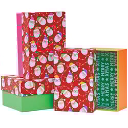 a stack of christmas boxes with one that says merry xmas on it
