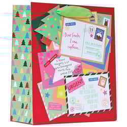 a stack of christmas cards with one that says dear santa i can explain