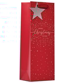a red gift bag that says merry christmas to you