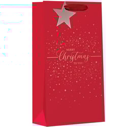 a red gift bag that says merry christmas to you