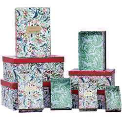 a stack of boxes with one that says merry christmas on it