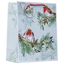 a christmas gift bag with two birds on a branch
