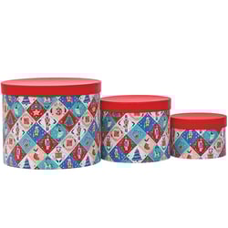three round boxes with a nutcracker pattern on them