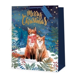 a merry christmas gift bag with two foxes on it