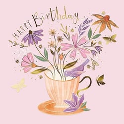 a birthday card with a cup of tea filled with flowers and a bird .