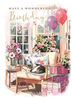a cat is sleeping in a chair with balloons and flowers on a birthday card .