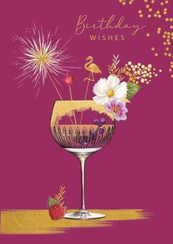 a birthday card with a wine glass filled with flowers and fireworks .