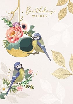 a birthday card with two birds and flowers on it .