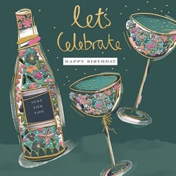 a birthday card with a bottle of champagne and two wine glasses filled with flowers .