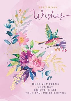 a birthday card with a hummingbird and flowers on it .