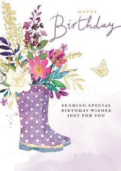 a birthday card with a pair of purple rain boots filled with flowers .