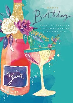 a birthday card with a bottle of champagne and a glass of champagne .