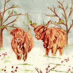 a paper napkin with a pattern of highland cows and trees