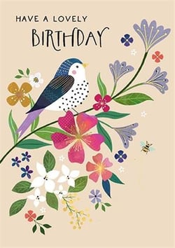 a birthday card with a bird sitting on a branch of flowers .