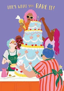 a group of women are decorating a cake together .