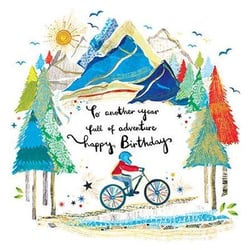 a boy is riding a bike in the mountains on a birthday card .