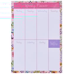 a pink and white weekly planner with flowers on it