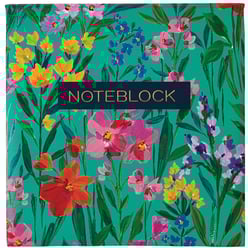 a notebook with colorful flowers on a green background