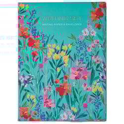 a writing set with colorful flowers on a blue background