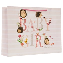 a baby girl gift bag with hedgehogs and flowers