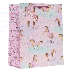 a pink gift bag with a pattern of horses on it