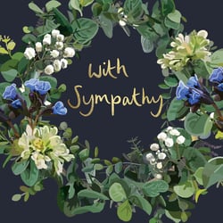 a card with a wreath of flowers and the words with sympathy