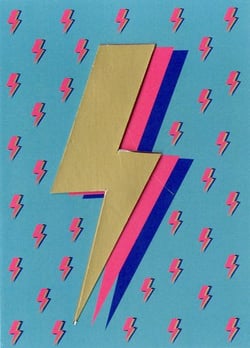 a paper lightning bolt with a pattern of lightning bolts on a blue background .