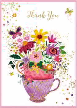 a thank you card with a teacup filled with flowers and butterflies .