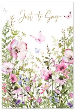 a greeting card with pink flowers and butterflies and the words `` just to say '' .