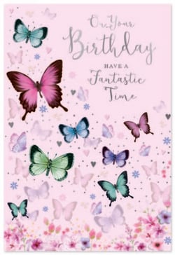 a birthday card with butterflies and flowers on a pink background .