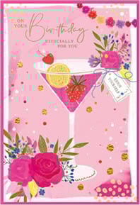 a pink birthday card with a martini and flowers on it .