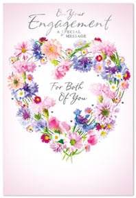 a pink engagement card with a heart made of flowers .